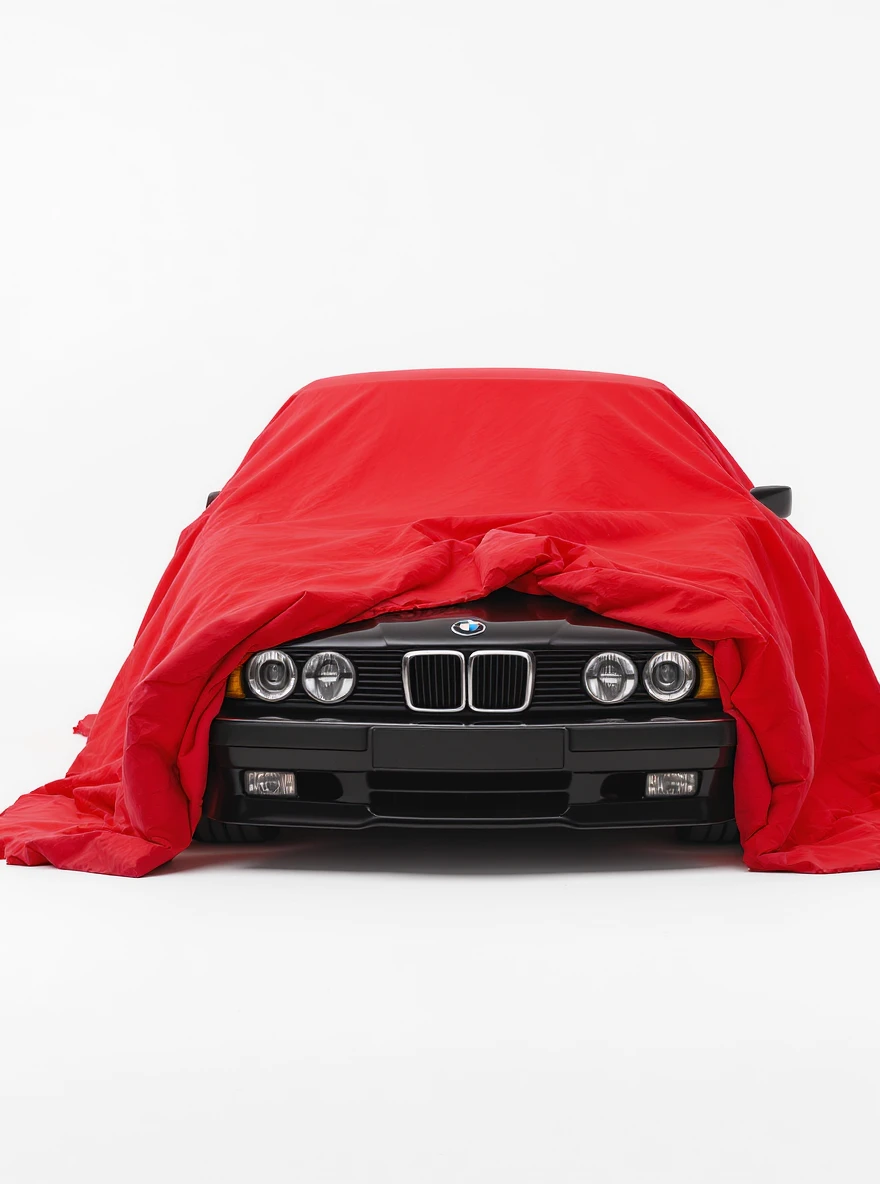 studio photo on a pure white background old black BMW E34 car is visible from under a red tent cover emoji