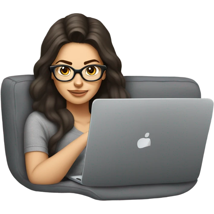 brunette girl laying on a grey couch with grey pillows with glasses on and a laptop on small table in front with coffee cup on mouse pad emoji