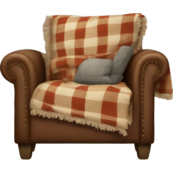A comfy armchair with a plaid throw draped over it emoji