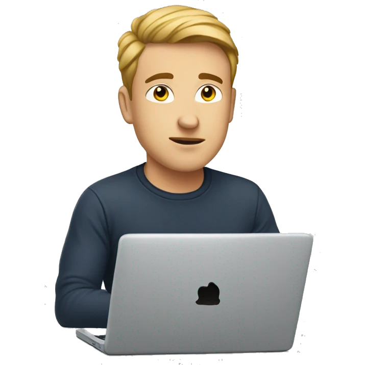 A white young man is sitting at a laptop in a T-shirt emoji
