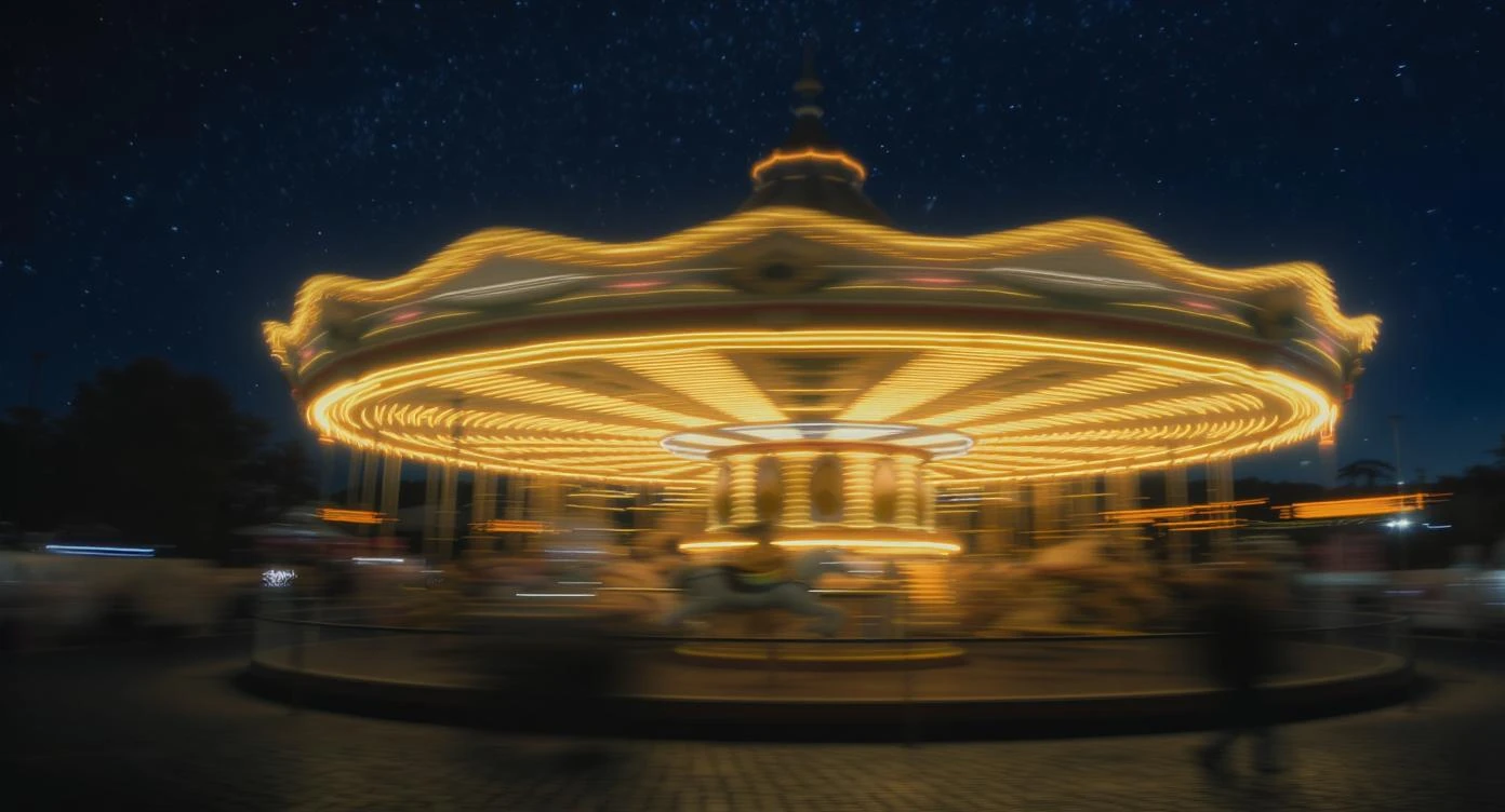 long exposure photo, a moving carousel at night emoji