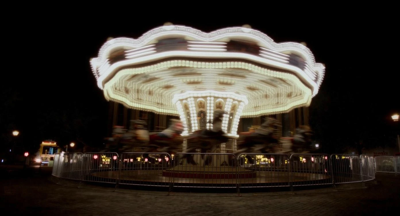 long exposure photo, a moving carousel at night emoji