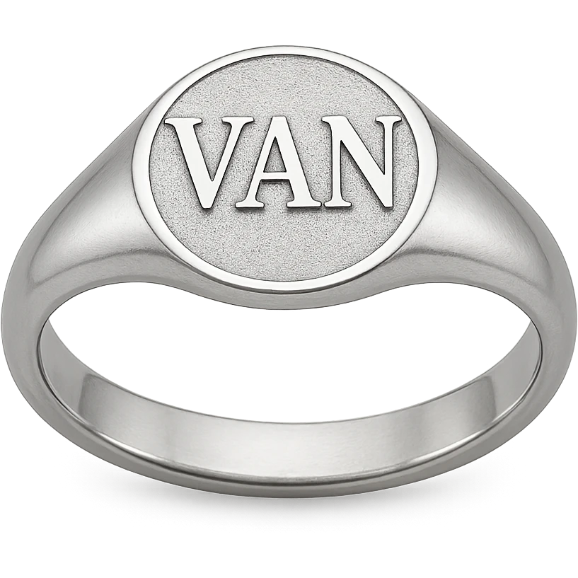 a silver ring with the letters V, A, and N engraved emoji