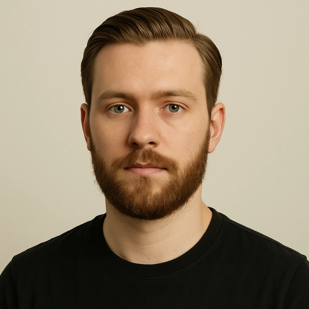 portrait of a young man with short light chestnut hair slicked back, medium-length thick beard, light green eyes, fair skin, oval face, neutral expression, wearing a dark t-shirt, plain light background, shoulder-up front view emoji