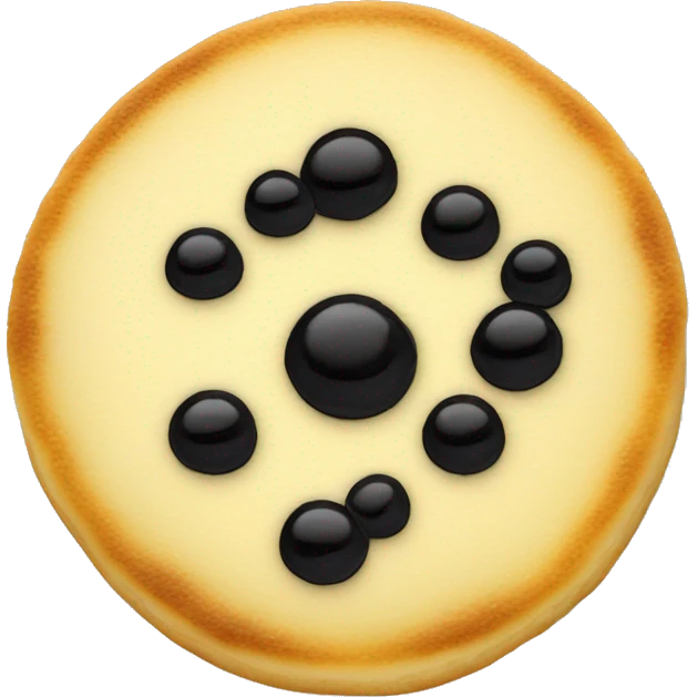 very small round pancake with craime fraiche and black caviar on top emoji