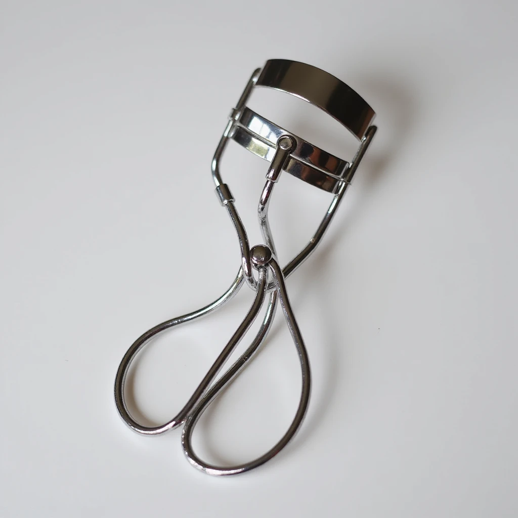 silver eyelash curler, close-up view, detailed, chrome finish emoji