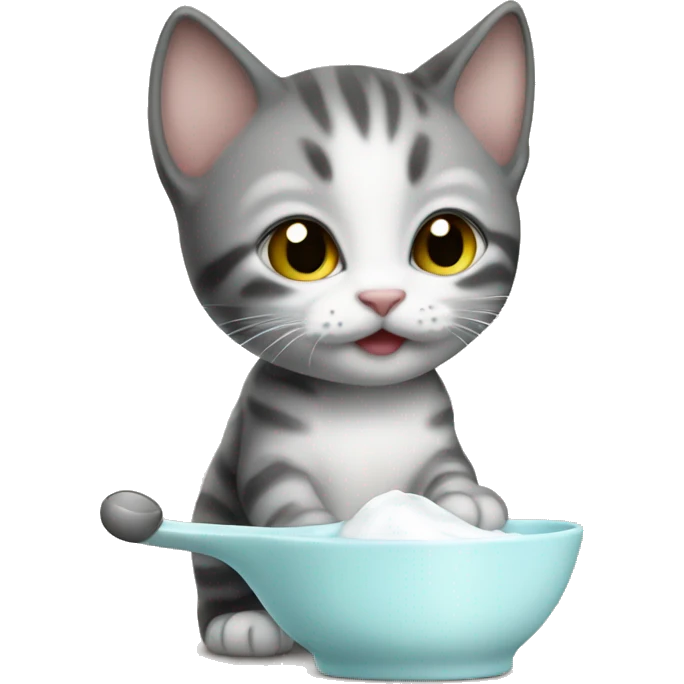 the kitten drinks milk from a spoon emoji
