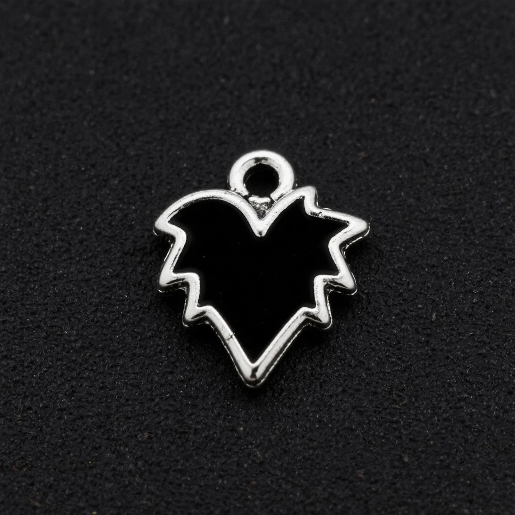 goth heart, matte black, sharp edges, small silver charm, modern dark aesthetic emoji