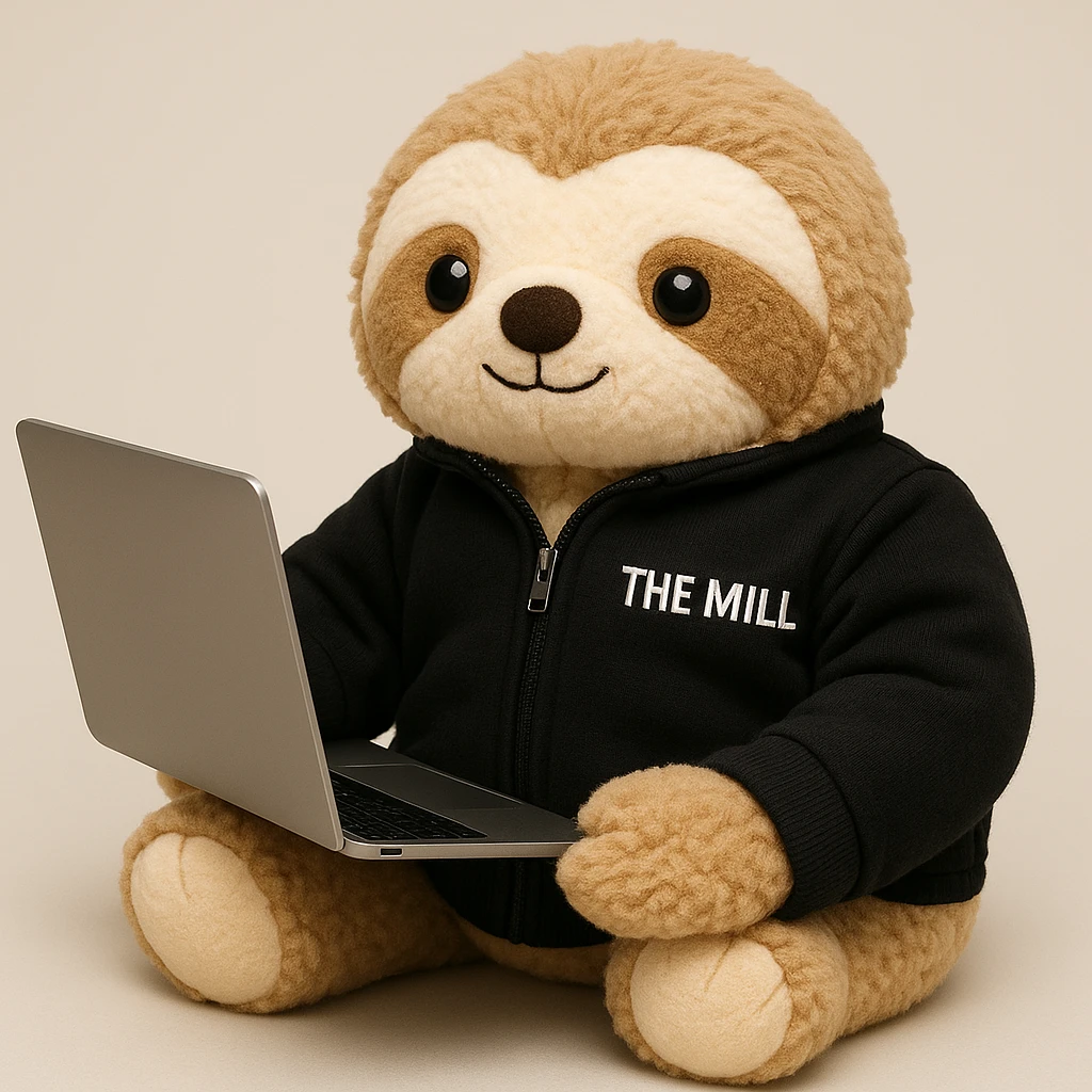 Make this sloth look like a plushy, soft and cuddly toy, inspired by the reference photo, but still wearing a black 'The Mill' jacket and looking business savvy. The style should reflect a plush toy softness and cuddliness. emoji