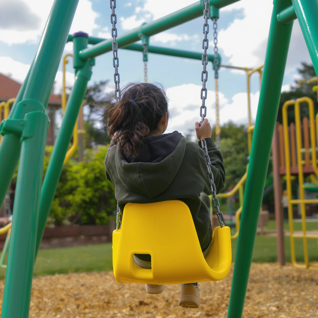 realistic playground swing-set, green frame, one yellow seat, outdoor setting emoji