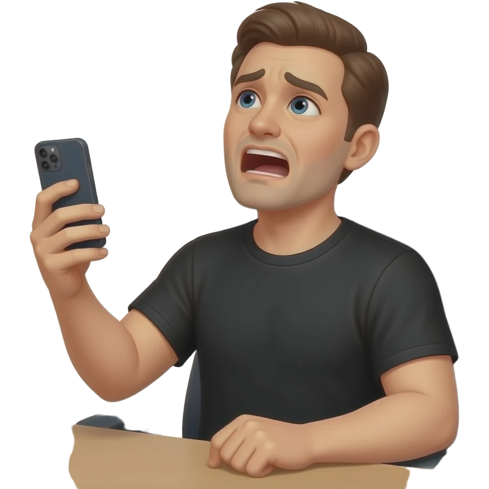 hombre de remera negra sentado en una silla,en su escritorio mirando para arriba abriendo la boca agotado con el celular el la mano izquierda emoji