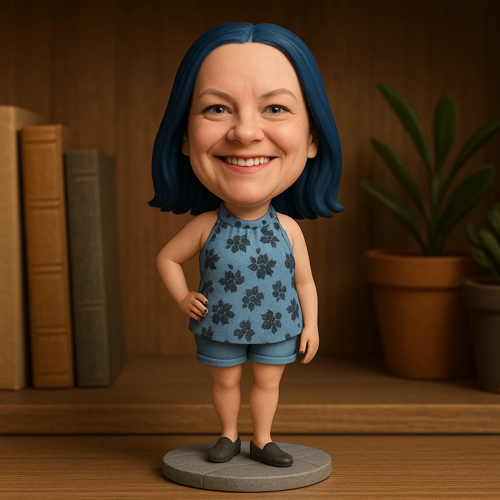 Woman with dark blue hair and blue fingernails standing on a sidewalk emoji