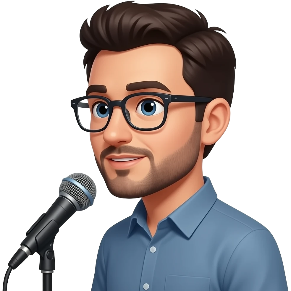 Молодой парень лет 30, темноволосый в очках, с короткой бородой, которая проходит вдоль линии подбородка и соединяется в маленькую полоску под нижней губой и короткими усами, стоит в профиль и говорит что-то в микрофон emoji