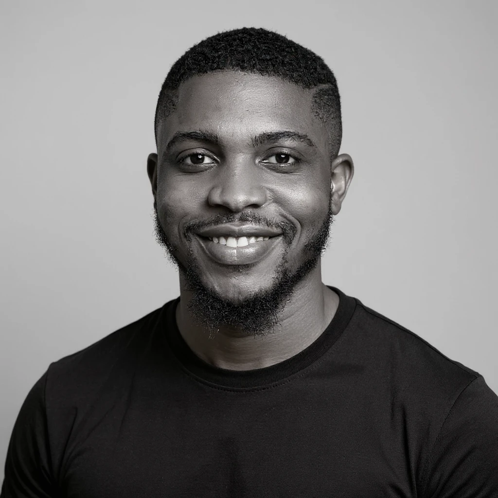 A professional portrait of me in monochrome. Plain black crew neck shirt. Tailored to LinkedIn. Tech boy vibe (programmer). I’m a black man from Nigeria. Retain facial features from attached image. Make face smoothie and healthy. No accessories. Light gray background to make subject more visible. emoji