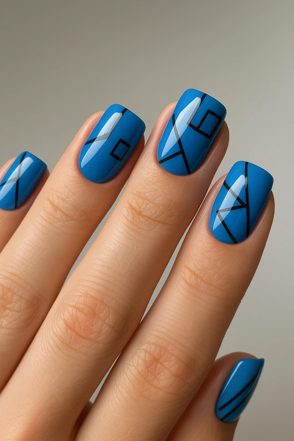 blue nails with geometric patterns emoji