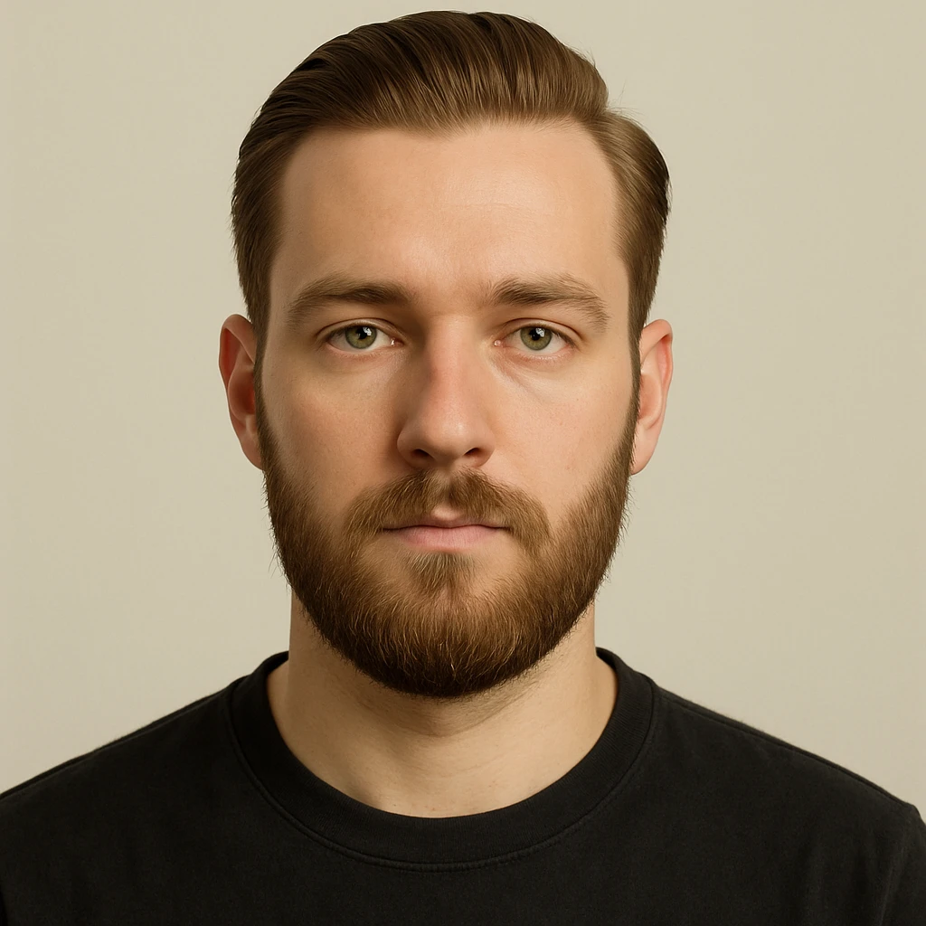 portrait of a young man with short light chestnut hair slicked back, medium-length thick beard, light green eyes, fair skin, oval face, neutral expression, wearing a dark t-shirt, plain light background, shoulder-up front view emoji