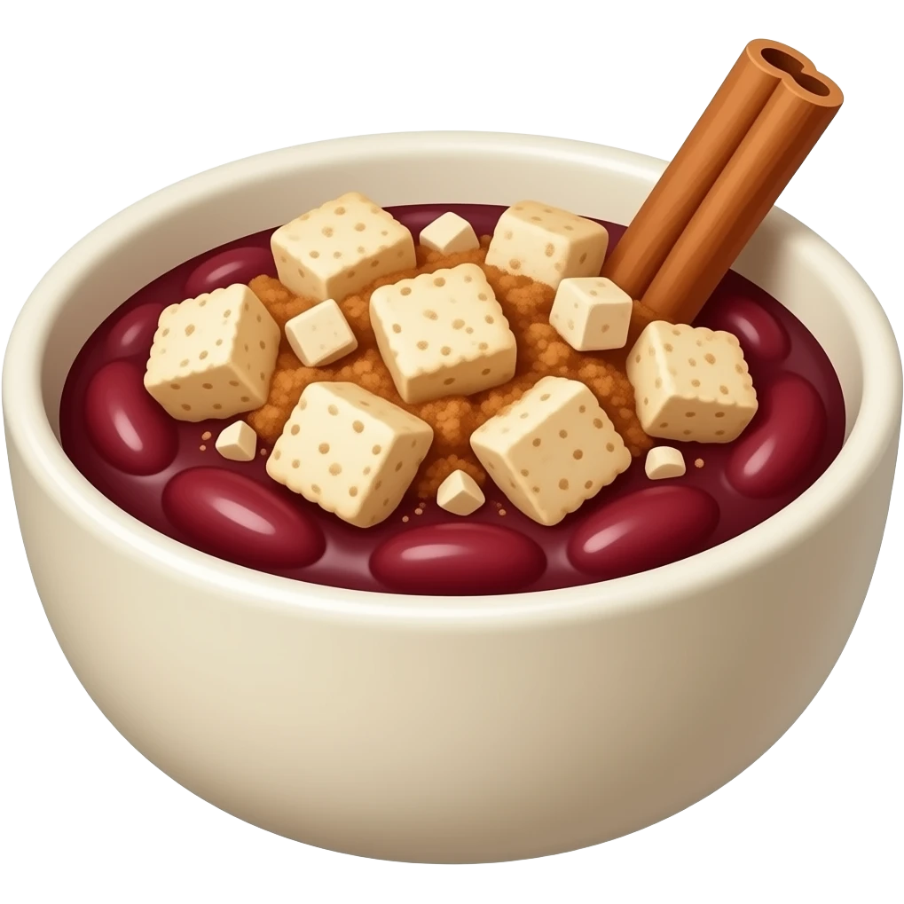 Un plato de unas habichuelas rojas licuadas con galletitas de leche encima y una astilla de canela en un tazón emoji