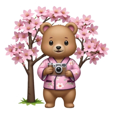 A cute light-brown bear wearing a pastel pink sakura-patterned kimono, normal balanced body ratio.  
Standing under a blooming sakura tree, holding a small camera and taking a picture with a happy smile.  
Kawaii emoji style, minimalistic clean sticker illustration, simple scenic background.
 sticker