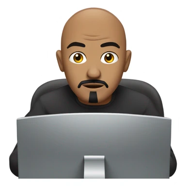 Bald man with black goatee working at computer sticker