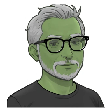 Indian man with grey hair,grey glasses, small beard and black t-shirt sticker