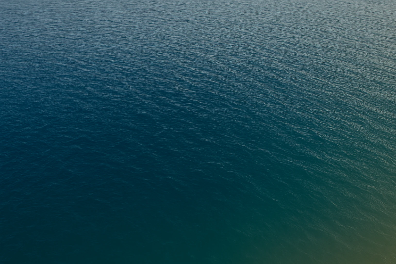 Create a photorealistic patch of ocean matching the angle, color, lighting, and texture of the ocean in the reference image. The view is looking down from above with no beach, no pier, and no extra elements. The background should be fully transparent. emoji