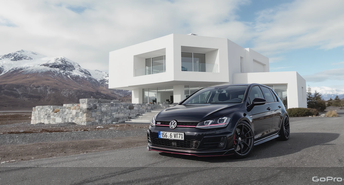 black Golf A4 with bodykit, in background is modern huge two flors white villa, in distance are iceland mountains, rule of thirds, shot on gopro hero, noise camera emoji