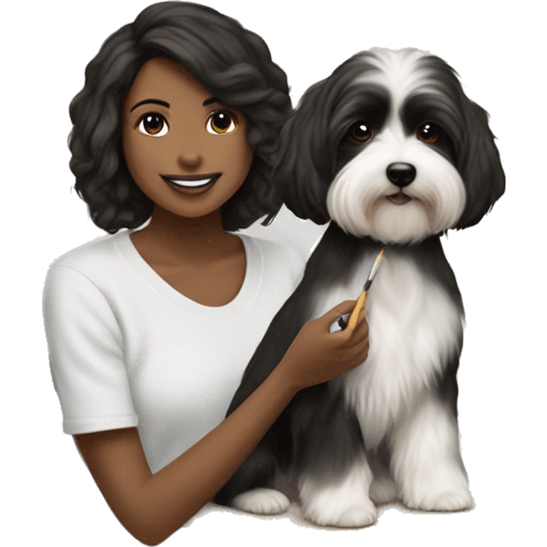 tan female artist painting black+white havanese on canvas emoji