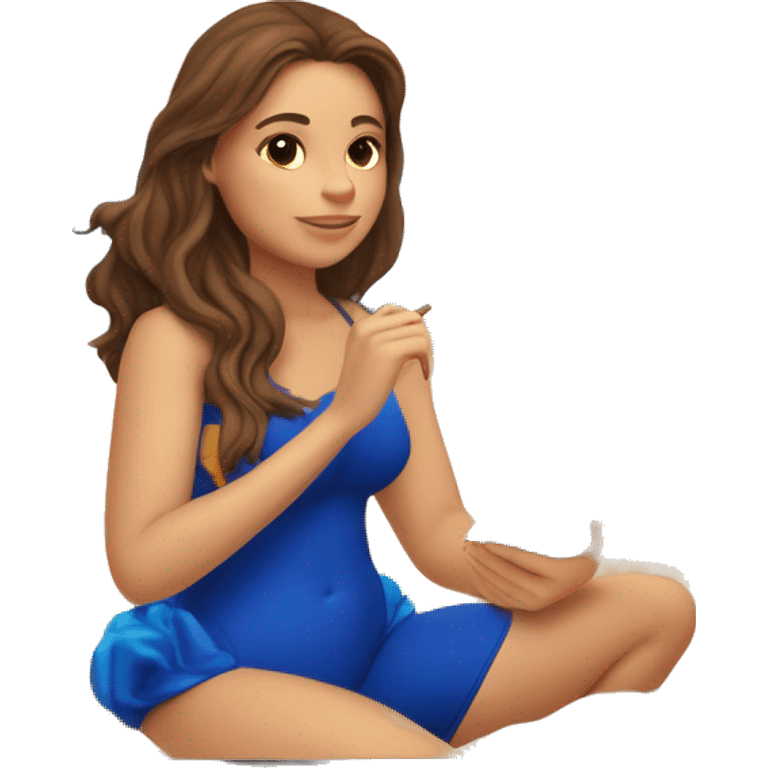 a girl with brown hair in a blue swimsuit sits on the sand by the sea and looks at the sunset in her hand holds a notebook in which the sea and sunset are drawn emoji