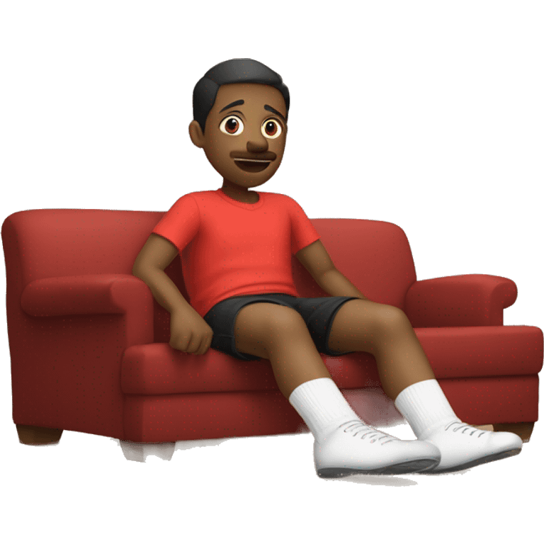 The image show a legs sitting on couch. They are wearing a dirty socks and red shorts. Their legs are extended, with one foot closer to the camera. The person is wearing white socks with black text near the top, one of which is on the floor. emoji