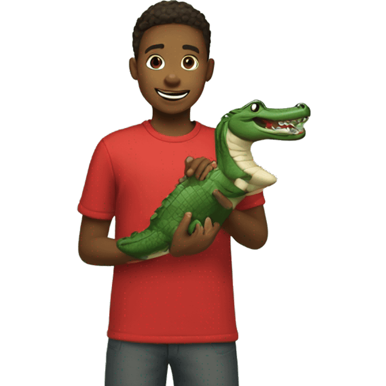 boy in red shirt outdoors holding alligator emoji