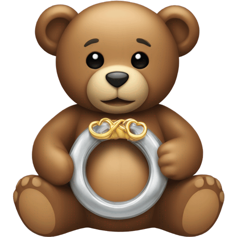 Teddy holding a Ring emoji